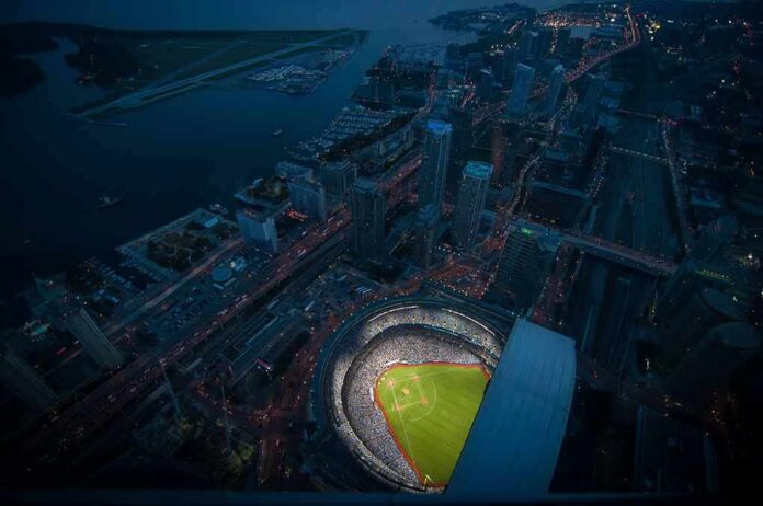 shutterstock_1456563776 Baseball stadium illuminated at night in a coastal city