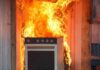 Mother Murders Baby in Oven – Walks Free Kitchen stove engulfed in flames against a wall