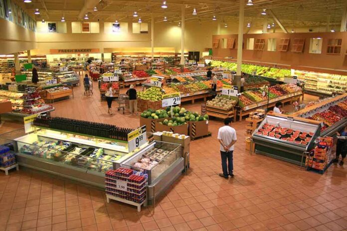 Interior of a grocery store filled with fresh produce and shoppers