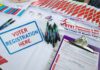 Woke State Allows 400,000 Voters Register Without Any ID Voter registration table with forms, pens, and informational materials