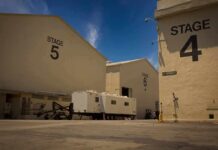 Paramount Studios Leaves California Amid Hollywood Exodus Film studio stages with numbered buildings and trailer