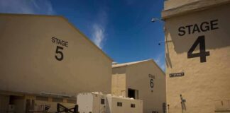 Film studio stages with numbered buildings and trailer