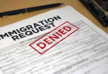 Judge Shuts Down Migrants Last-Minute ‘Bisexual’ Claim Immigration request form with denied stamp on a desk