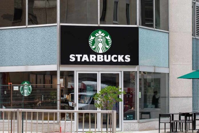 shutterstock_2320394477 Starbucks storefront with logo and glass entrance