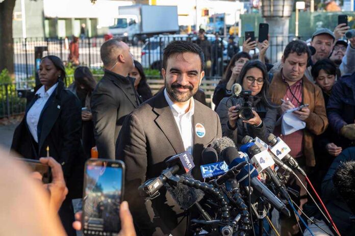 Democratic,New,York,City,Mayoral,Candidate,Zohran,Mamdani,Speaks,To Zohran Mamdani speaks at a press conference; Julia Bacha is visible among the crowd