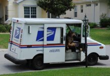 Feds ARREST Mailman – THOUSANDS of Mail Hoarded USPS mail truck parked at a suburban mailbox