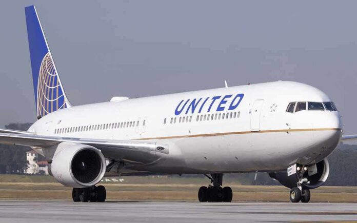 United Airlines jet taxiing on runway