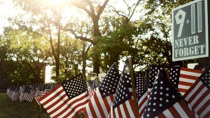 shutterstock_650176444-1 American flags displayed outdoors at a memorial