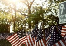 Abdul El-Sayed Hosts Muslim Rally Days Ahead of 9/11 American flags displayed outdoors at a memorial