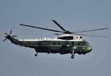 Trump RAGES At Marine One Pilot During Xi Meeting Green and white helicopter in flight
