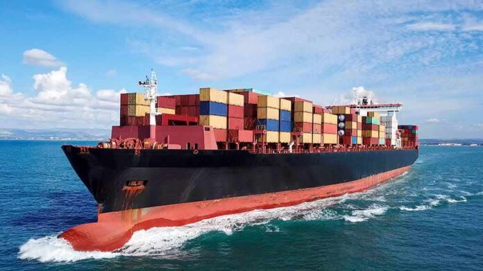 Container ship carrying stacked cargo at sea