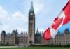 EU Throws Open Door To Canada Canadian flag with Parliament building in background