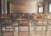 Protest Erupts: Tear Gas Drowns Classrooms Fight Empty classroom with rows of wooden desks and chairs