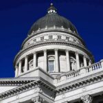 GOP Rep VINDICATED – 3 Charged in Sex Assault Case Capitol building dome with columns against a deep blue sky