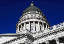 GOP Rep VINDICATED – 3 Charged in Sex Assault Case Capitol building dome with columns against a deep blue sky