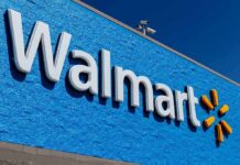 Senator RESIGNS After Being Caught Shoplifting! Walmart storefront sign on bright blue exterior wall