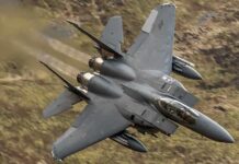 Stealth Jet Crashes – Midnight Training Disaster! Fighter jet banking low over rugged terrain