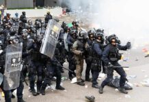 Trump Warned France 2 Years Ago – Not It Burns! Dontrelle Inman and Tom Mandrake among riot police advancing with shields in tear gas