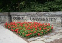 ‘The View’ Host Bizarrely DEFENDS Cornell Rapists Cornell University stone sign with red flowers