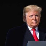 Crowd Cheers After Trump Says Let Iran Take Out California Donald Trump at a podium with a microphone