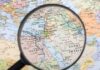 Magnifying glass over Middle East map