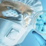 Plague Panic Erupts – Moscow Goes Mute Scientist in protective gear examining a petri dish