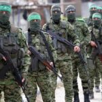 Hamas Is Thrilled With Nobel Peace Prize Winner Armed men in camouflage uniforms standing in a line