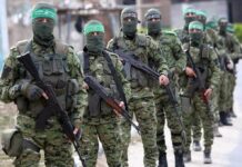 Hamas Is Thrilled With Nobel Peace Prize Winner Armed men in camouflage uniforms standing in a line
