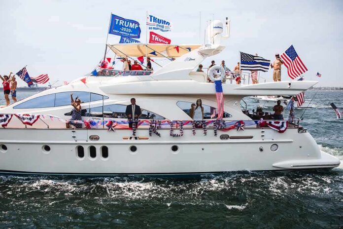 shutterstock_1827763256 Stephen Paea on a decorated yacht with American flags during a boat parade