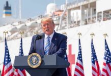 Trump Calls for Mandatory Prison Sentences for Crooked Politicians Donald Trump speaking at a podium with American flags and a ship in the background
