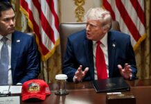 Trump Announces $25 Million Whistleblower Fraud Program Donald Trump speaks at a meeting table beside Marco Rubio