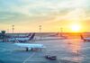 American Among Airport Bombing Casualties Airplanes on airport tarmac at sunset