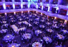 Trump Crashes Fox News Stars Wedding Ballroom filled with round tables at a formal gala dinner