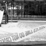 Teen Strangled to Death on Playground Playground closed off with caution tape in black and white
