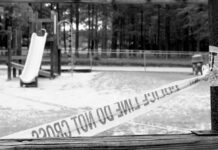 Teen Strangled to Death on Playground Playground closed off with caution tape in black and white