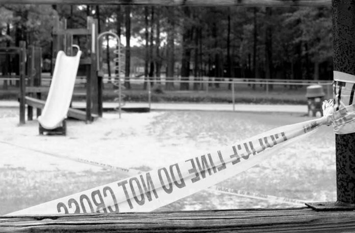 shutterstock_411555724 Playground closed off with caution tape in black and white