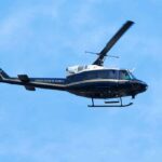 Runway Scare: Second Lady Stumbles With Newborn Helicopter flying against a blue sky