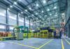 1,341 Jobs VANISH Minutes Before Trump Rally Automated factory floor with industrial machinery and safety railings
